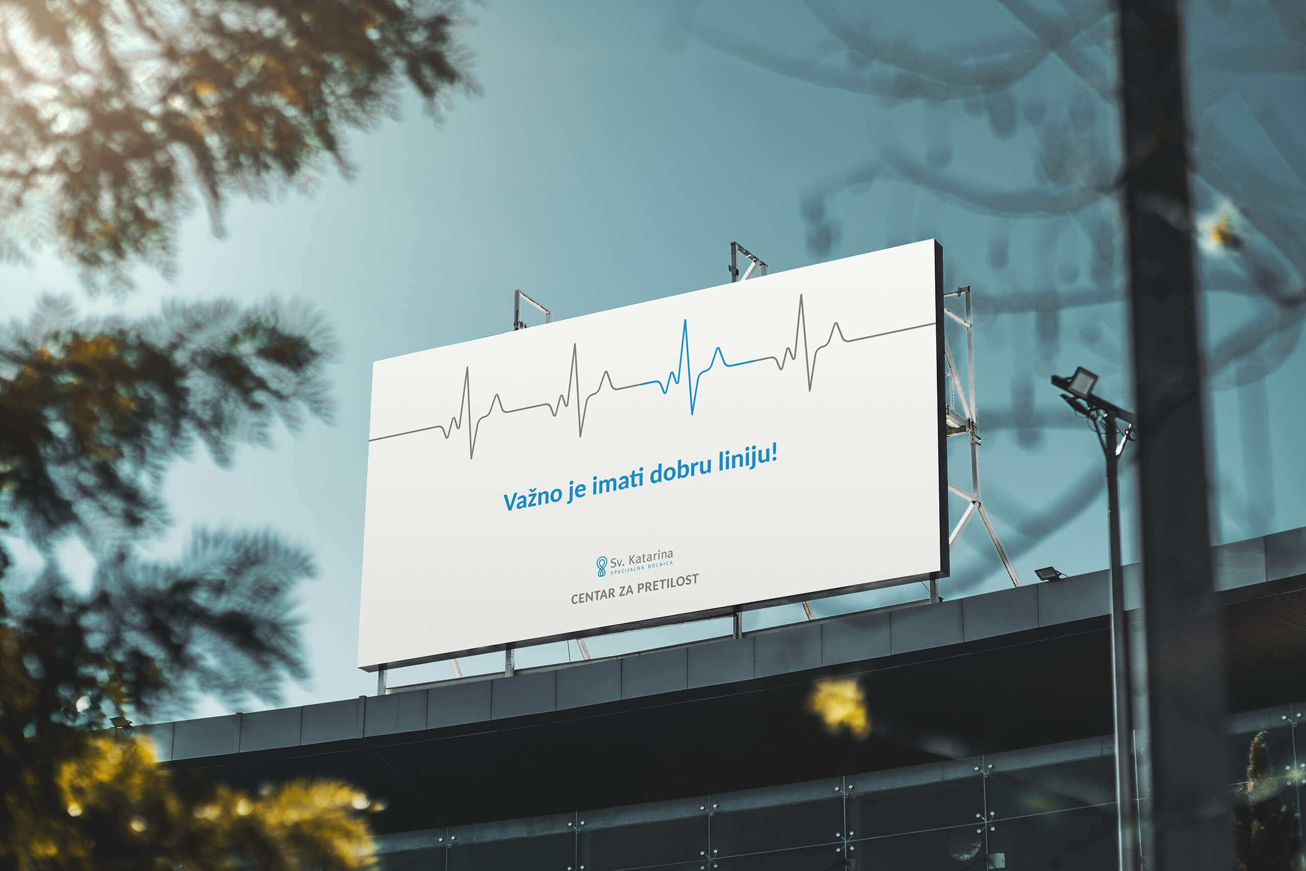 A billboard for St. Catherine's Hospital - obesity center, that says it is important to have a good line (and the correct heart rate is shown).