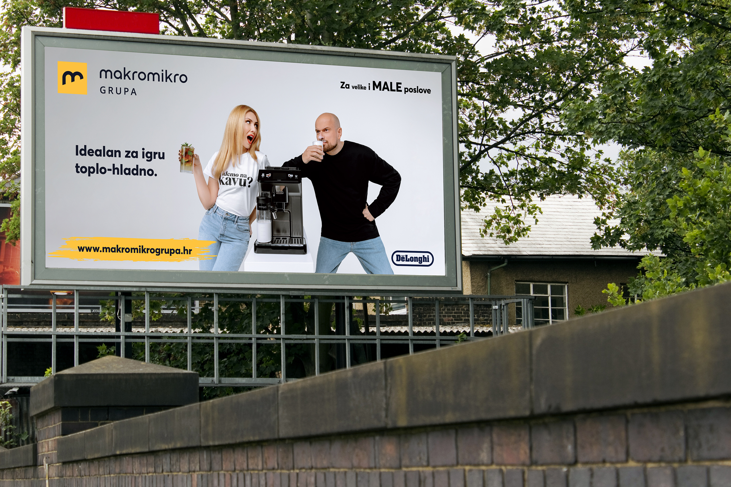 Croatian radio presenter Ivana Miseric and rapper Vojko V drink liquid from the machine.