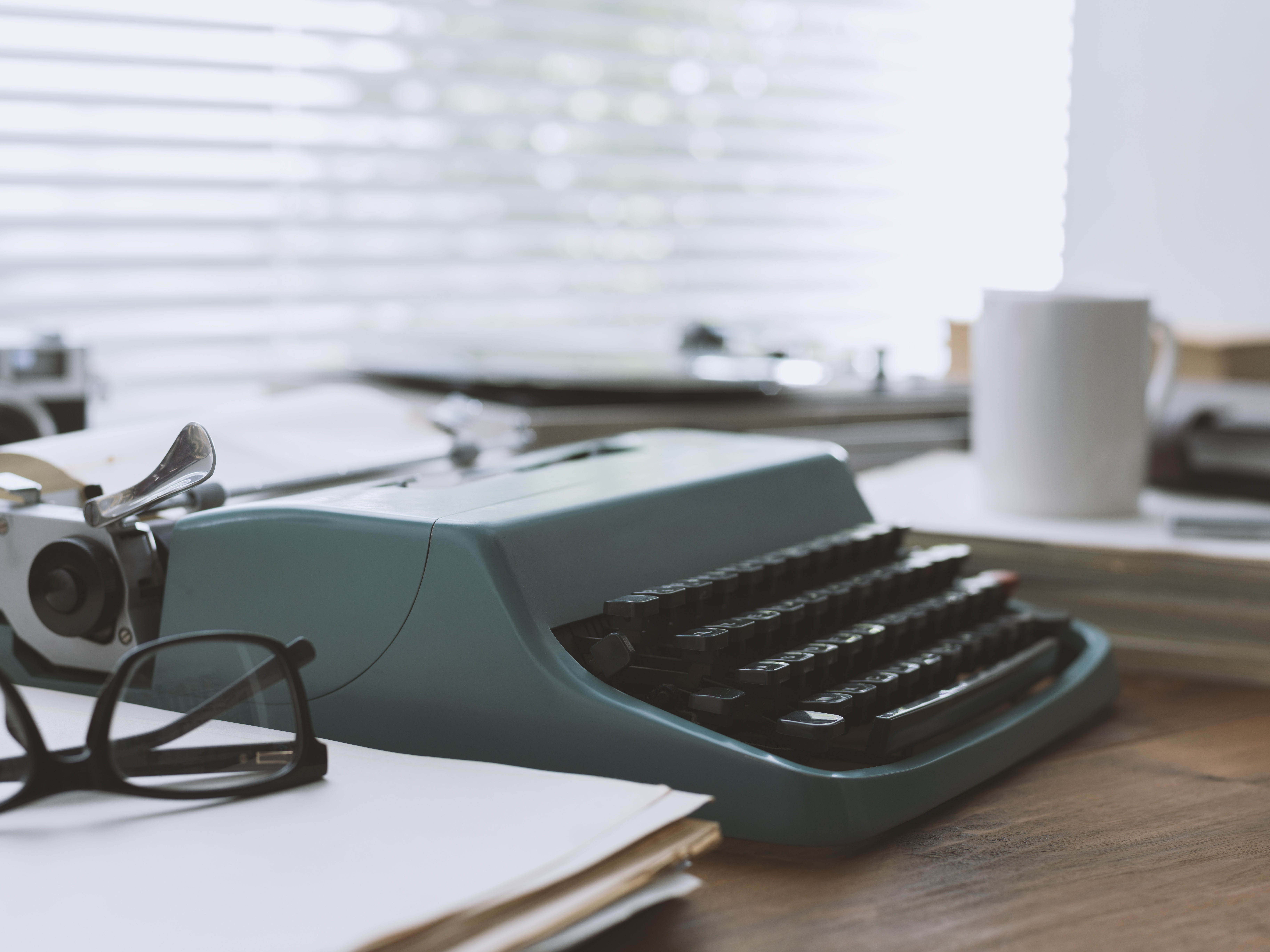 Retro workspace setup for writing with typewriter and record player