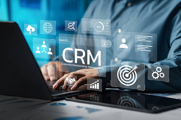 Customer Relationship Management interface displayed on a laptop screen with digital analytical icons.