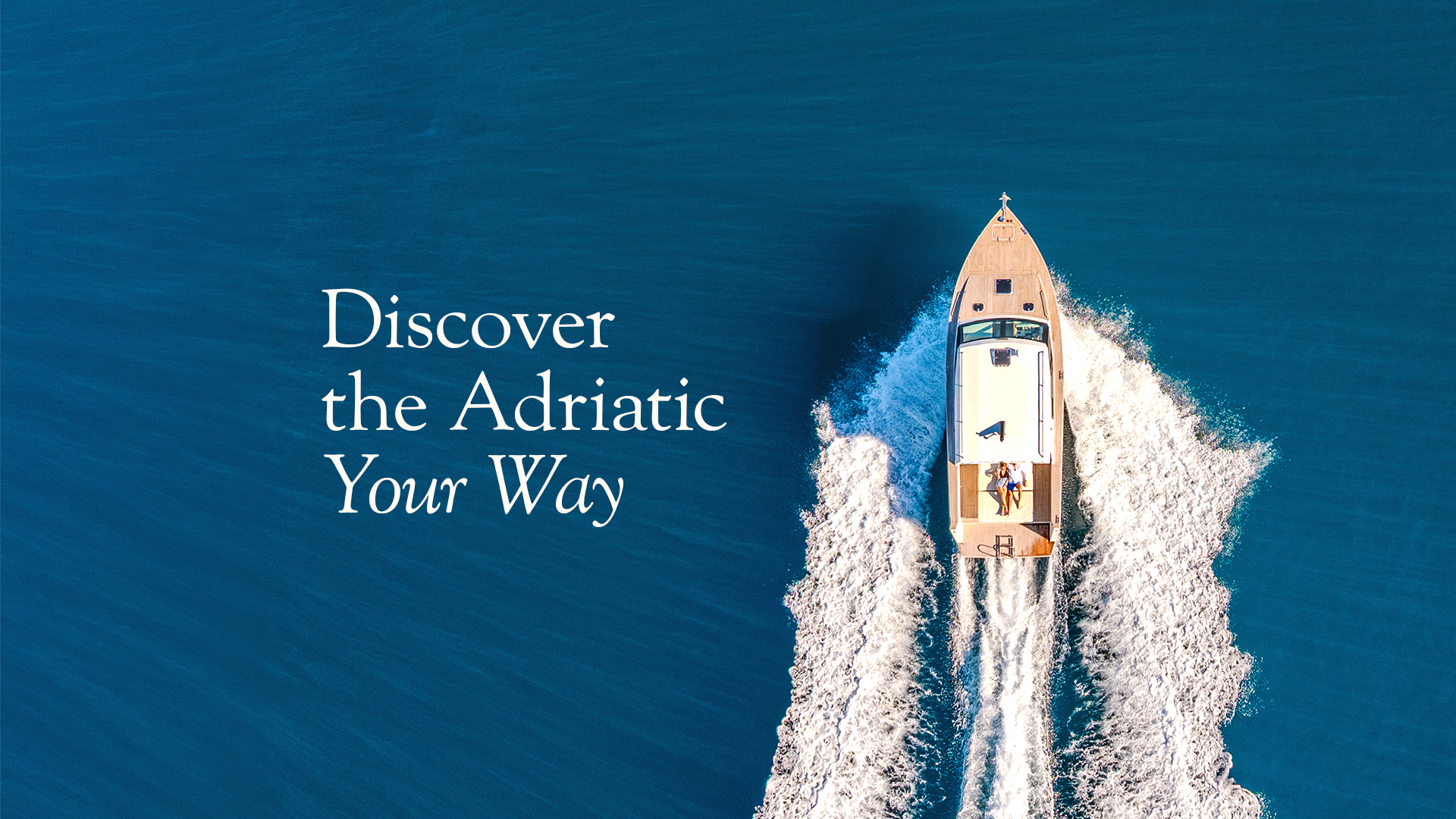 Top-down view of a private boat cruising across the sea with the message “Discover the Adriatic Your Way”.